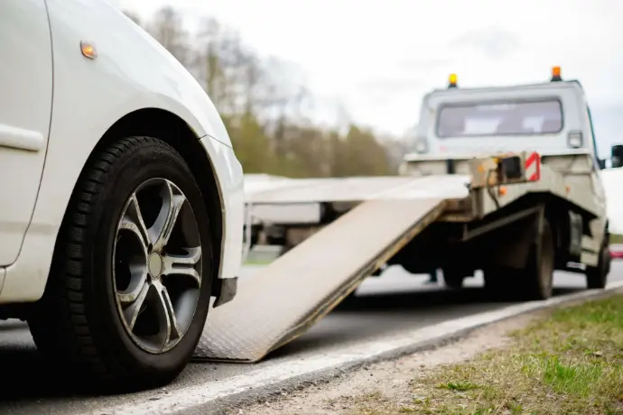 Insurance claimant gets car towed in